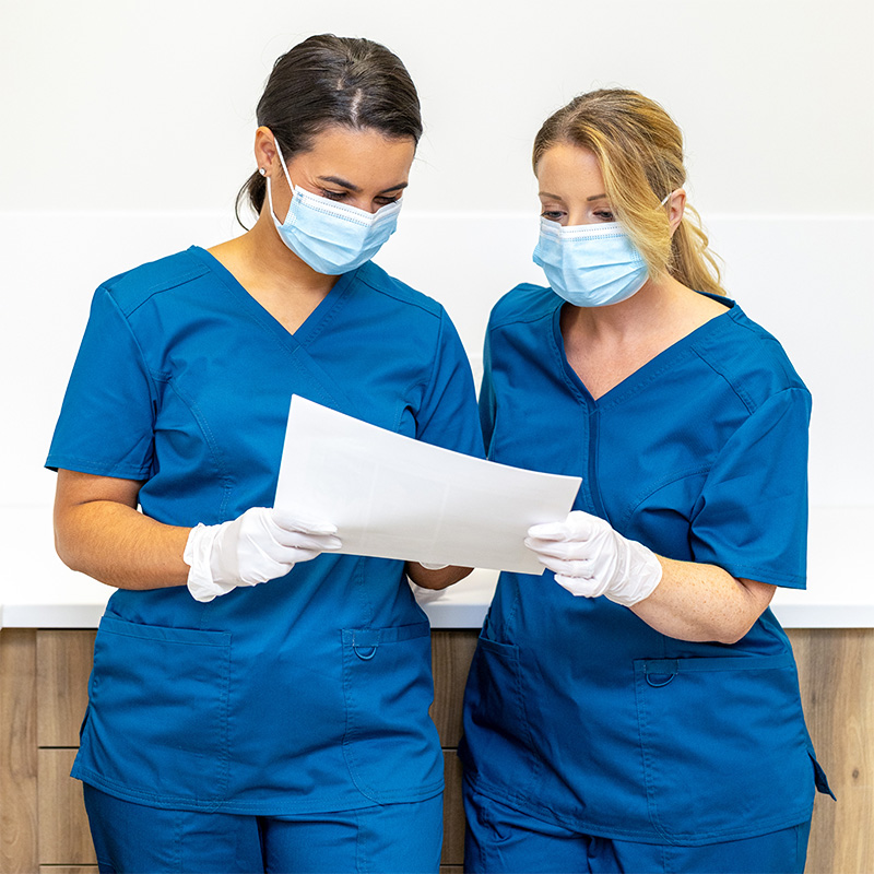 PerCuro nurses reviewing patient information